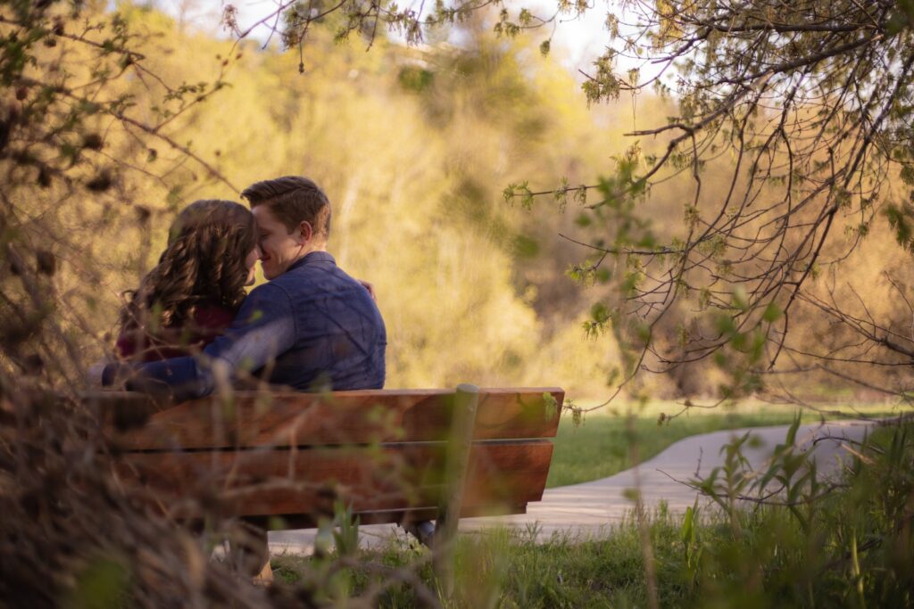 Photography of Couple Sitting on Bench-Loving Relationship