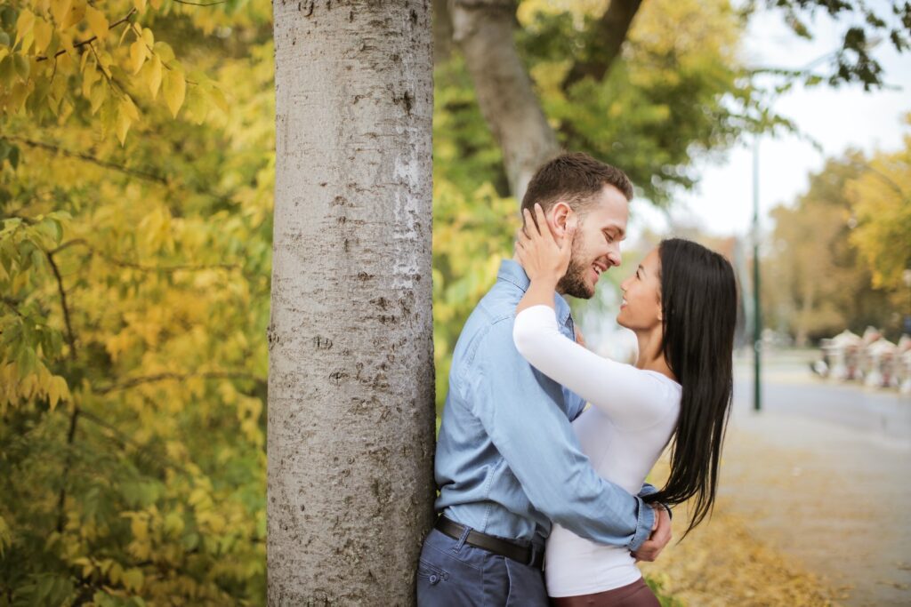 Couple Is Hugging Beside Tree Trunks-Romance Alive in a Busy Family Life