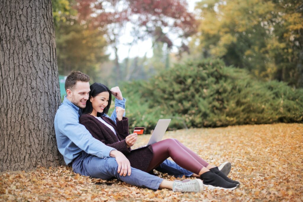 Couple Reclining Beside Tree Trunks-Long-Term Committed Relationship