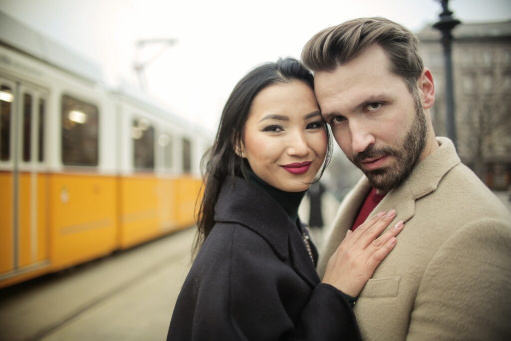 Man and Woman Standing beside Yellow Train-Thriving Relationship