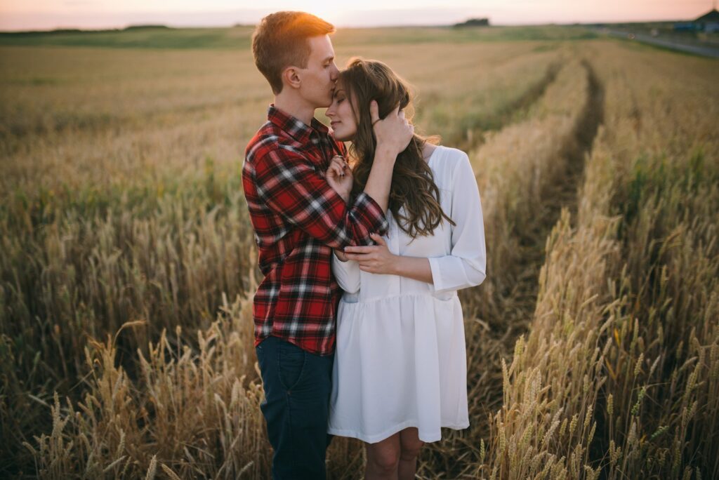 Man and Woman Kissing on the Field During Sunset-Communication Skills