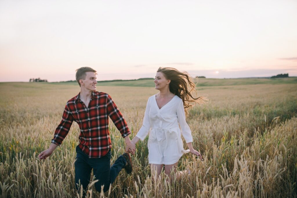 A Couple Running on a Wheat Field while Looking at Each Other-Communication Skills