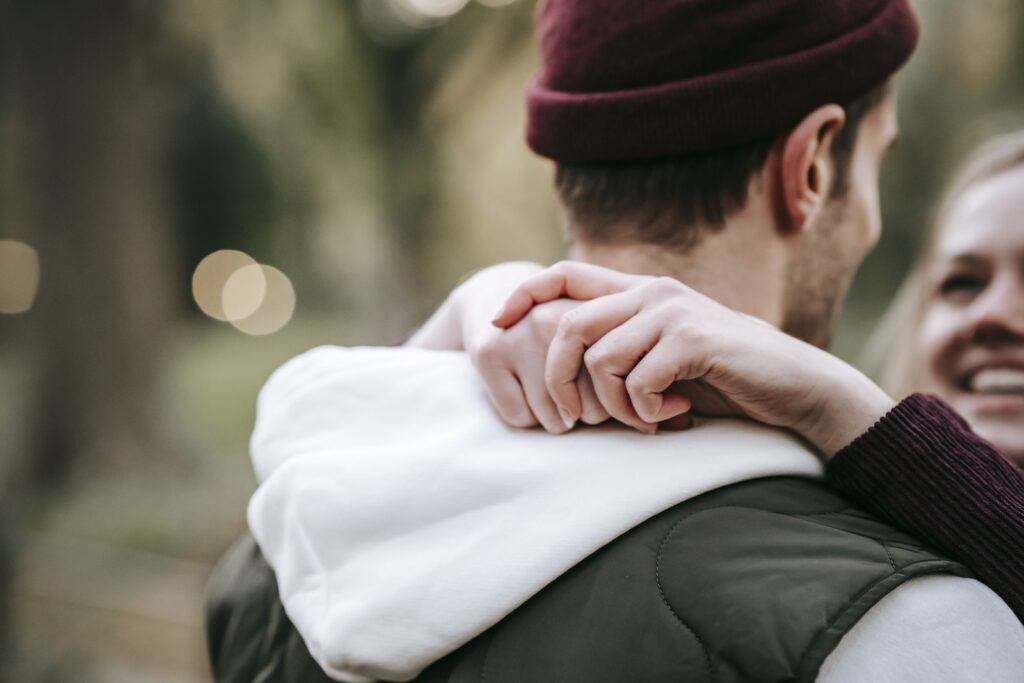 Unrecognizable happy couple hugging in park-Toxic Relationship