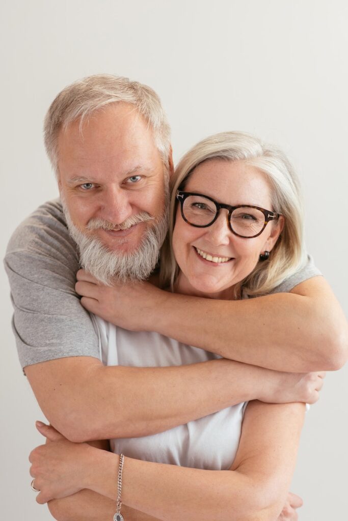 Close-Up Shot of a Happy Elderly Couple Hugging while Looking at Camera- dating tips for shy people over 50