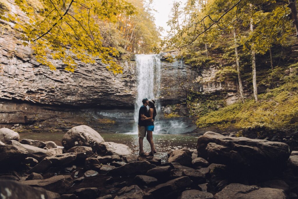 couples kissing in front of waterfalls- your ex still has feelings for you