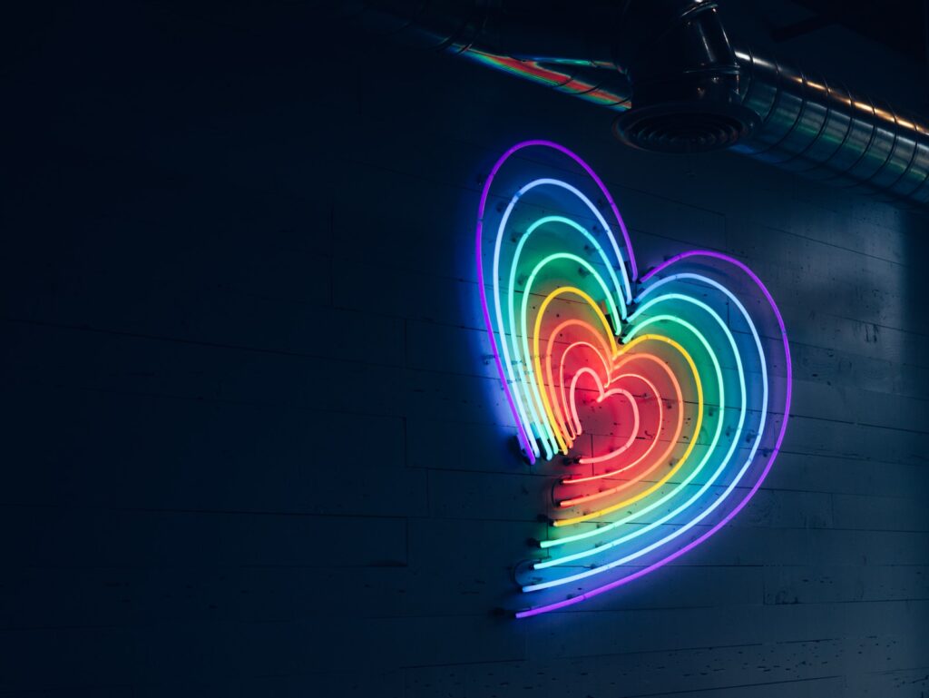 multicolored heart LED light on wall- fear of love