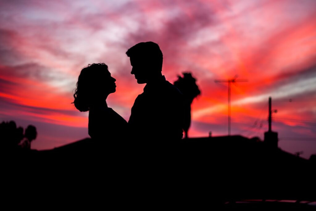 silhouette of man and woman facing each other during golden hour- Long-Distance Love