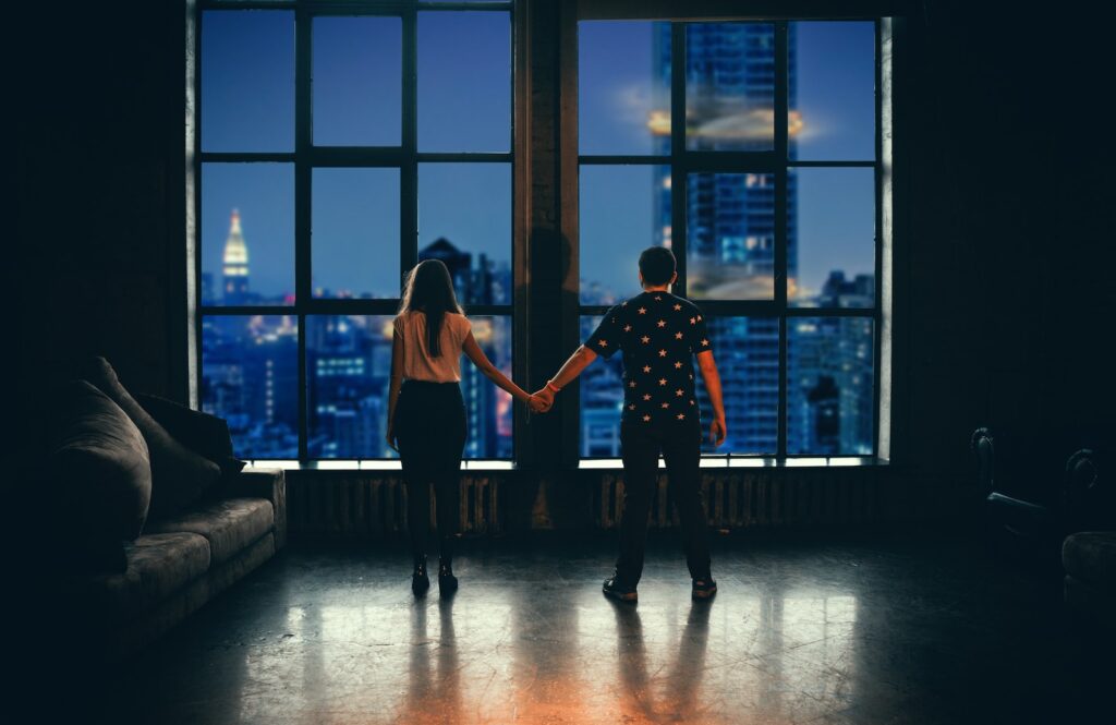 man and woman holding hands in front of glass window-Relationship is Built to Last