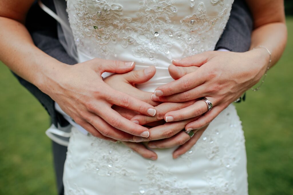 shallow focus photography of person hugging a person in white dress-lasting relationship