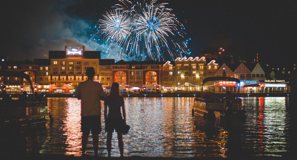 two people standing beside body of water watching fireworks-Building a Strong Foundation