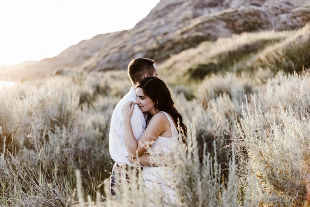 man hugging woman near mountain- build a strong relationship