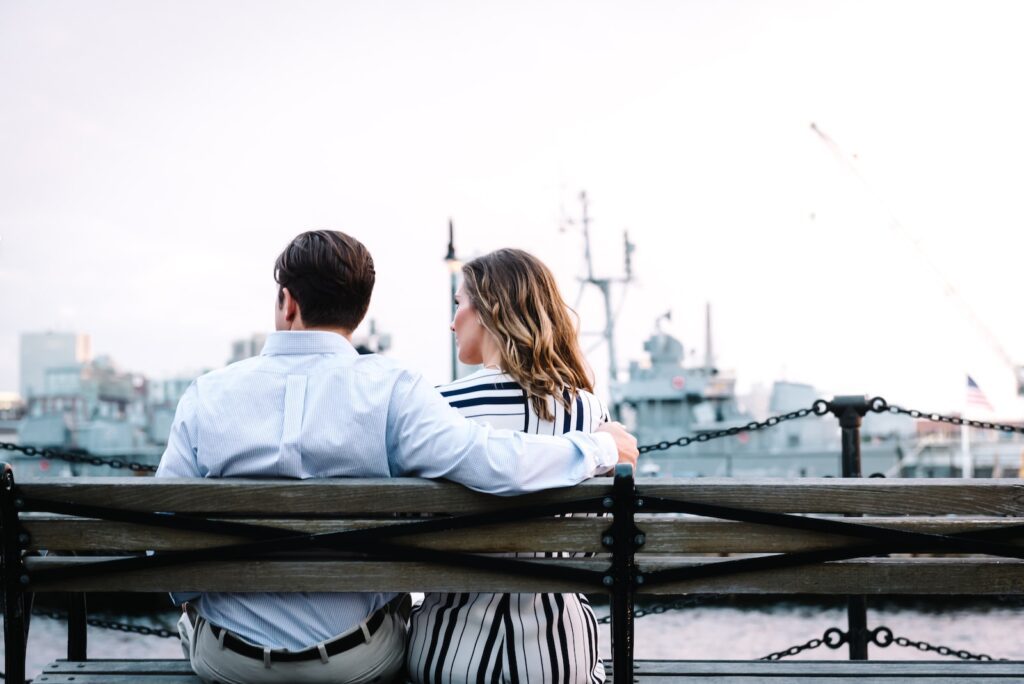 couple sitting on bench near body of water
- Communicate Effectively