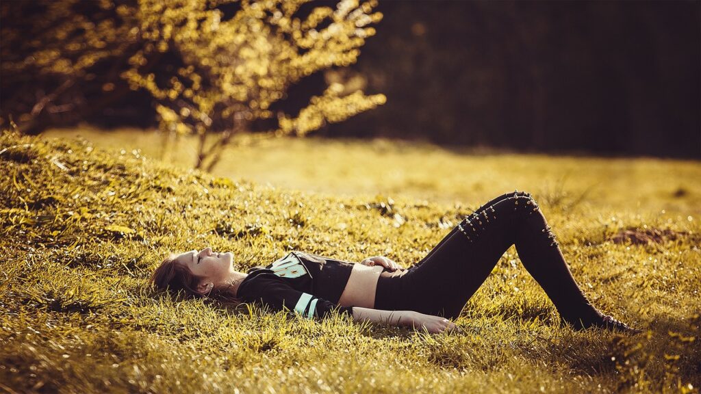 girl lying on the grass, girl, legs-Art of Seduction