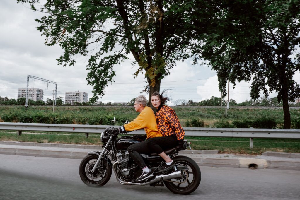 A Man and Woman Riding a Motorcycle Together Celebrate Your Partner's Achievements