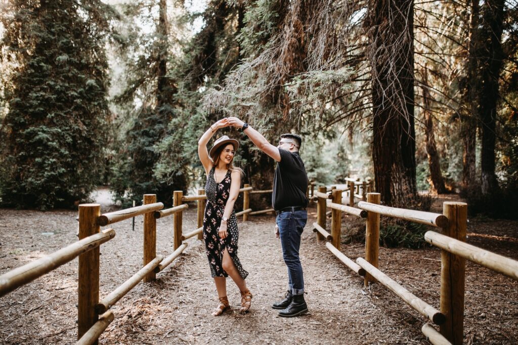 man and woman dancing between brown wooden handrails-Managing Relationship Stress