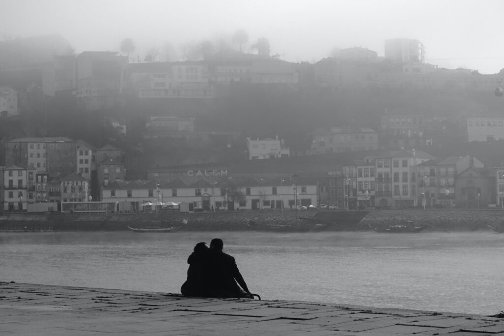 silhouette of person sitting on rock near body of water during daytime-Apologizing to your partner
