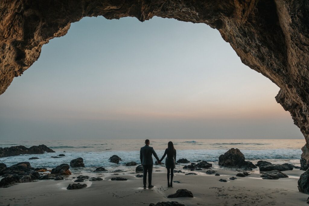 man and woman holding hands facing sea-Relationship is Worth Fighting For