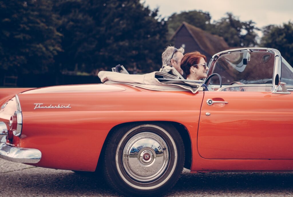 two person riding vintage coupe-Healthy Relationship After 50