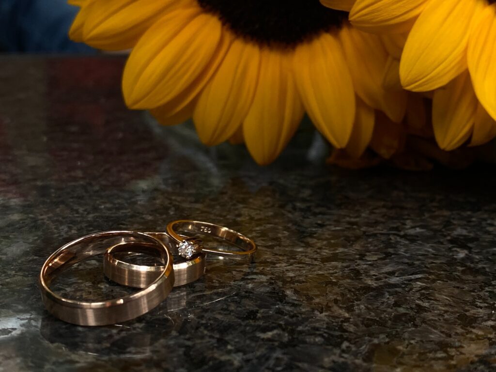 silver-colored ring and yellow Sunflowers- Long-Term Marriage