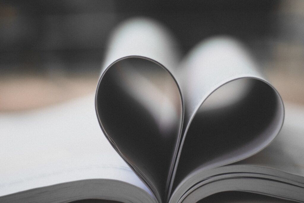 Closeup Photography of Book Page Folding Forming Heart-When Jealousy