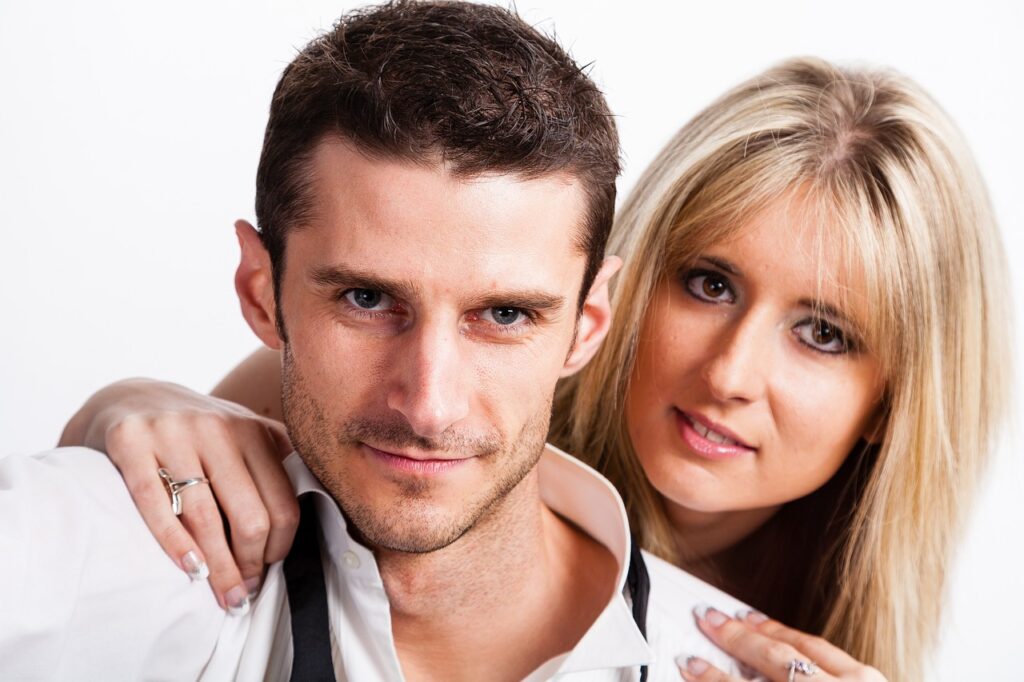 couple, smiling, woman-Signs He's Into You