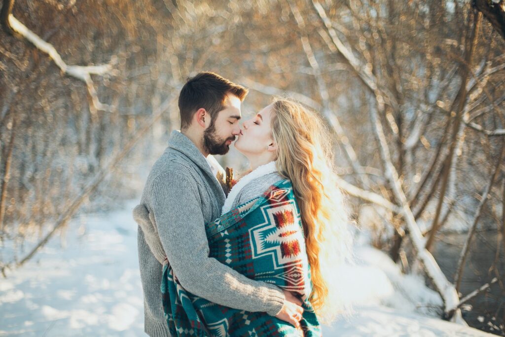 Man and Woman Hugging Each Other About to Kiss during Snow Season-Non-Verbal