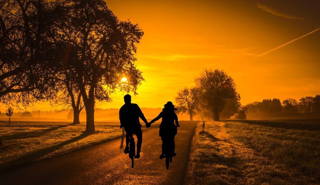 sunset, couple, bicycle-Women Can Improve Communication in Their Marriage