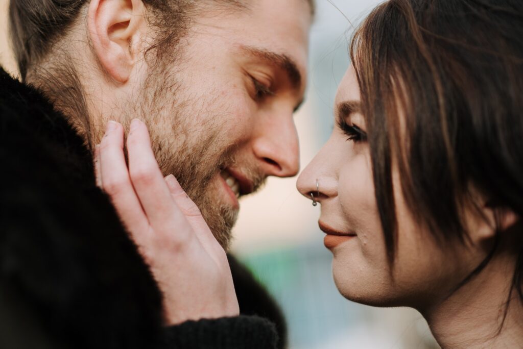 Young woman touching face of smiling boyfriend-Bible Say About Supporting Your Spouse