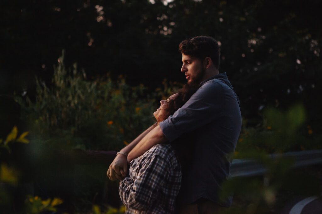 Loving young couple cuddling and enjoying sunset in nature-Get a Guy to Ask Me Out