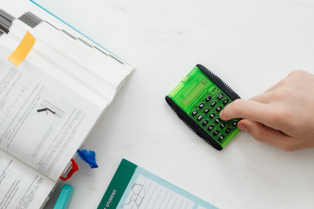 Person Using A Green and Black Calculator
Financial Problems 