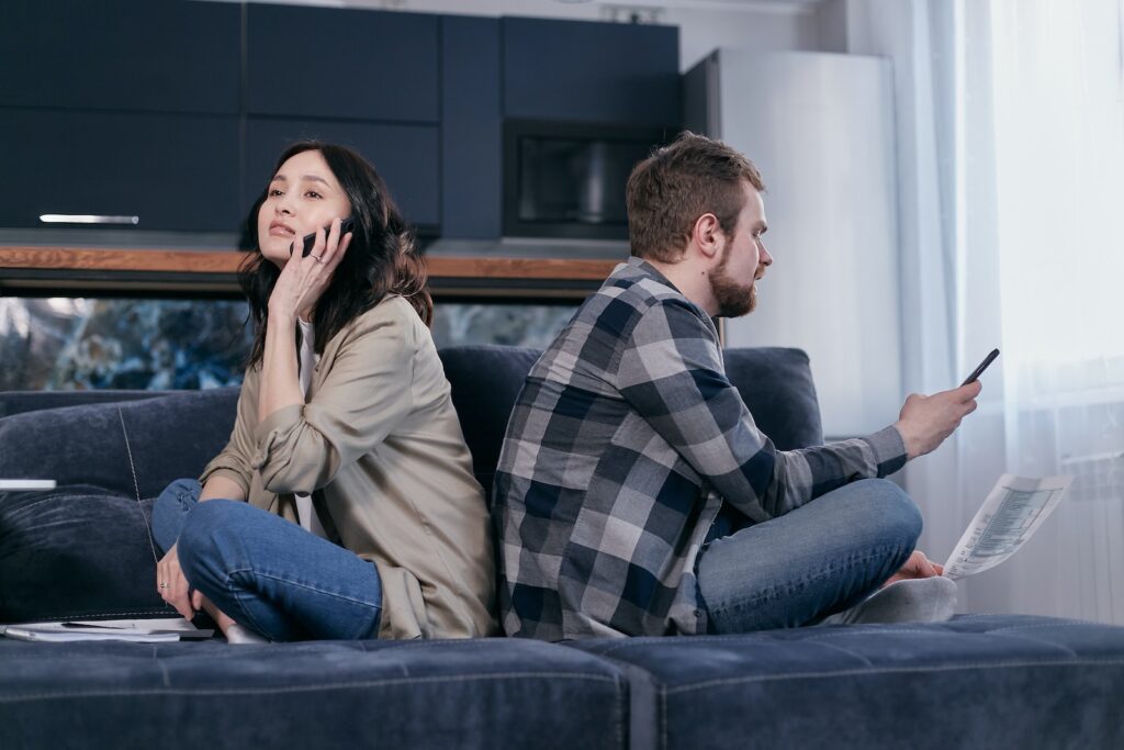 Man and Woman Sitting on Blue Couch
Financial Problems 