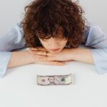 Curly-Haired Woman Having a Financial Problem Financial Problems