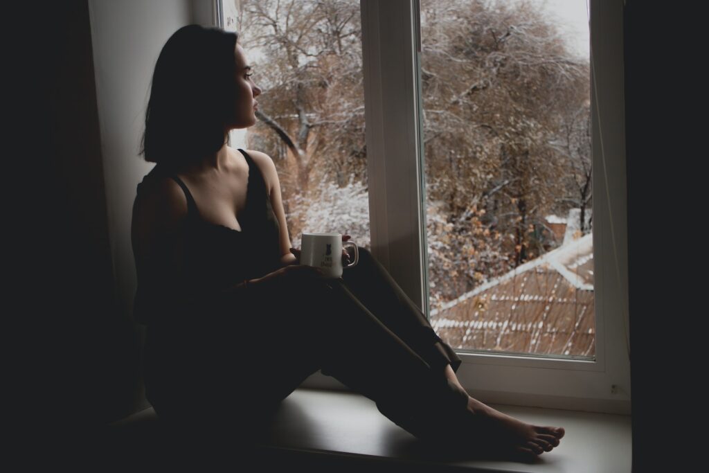 woman in black tank top sitting on window-Heartthrob Moments in Movie