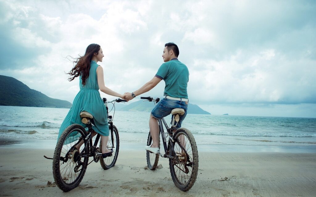 couple, beach, bicycles-Attract True Love